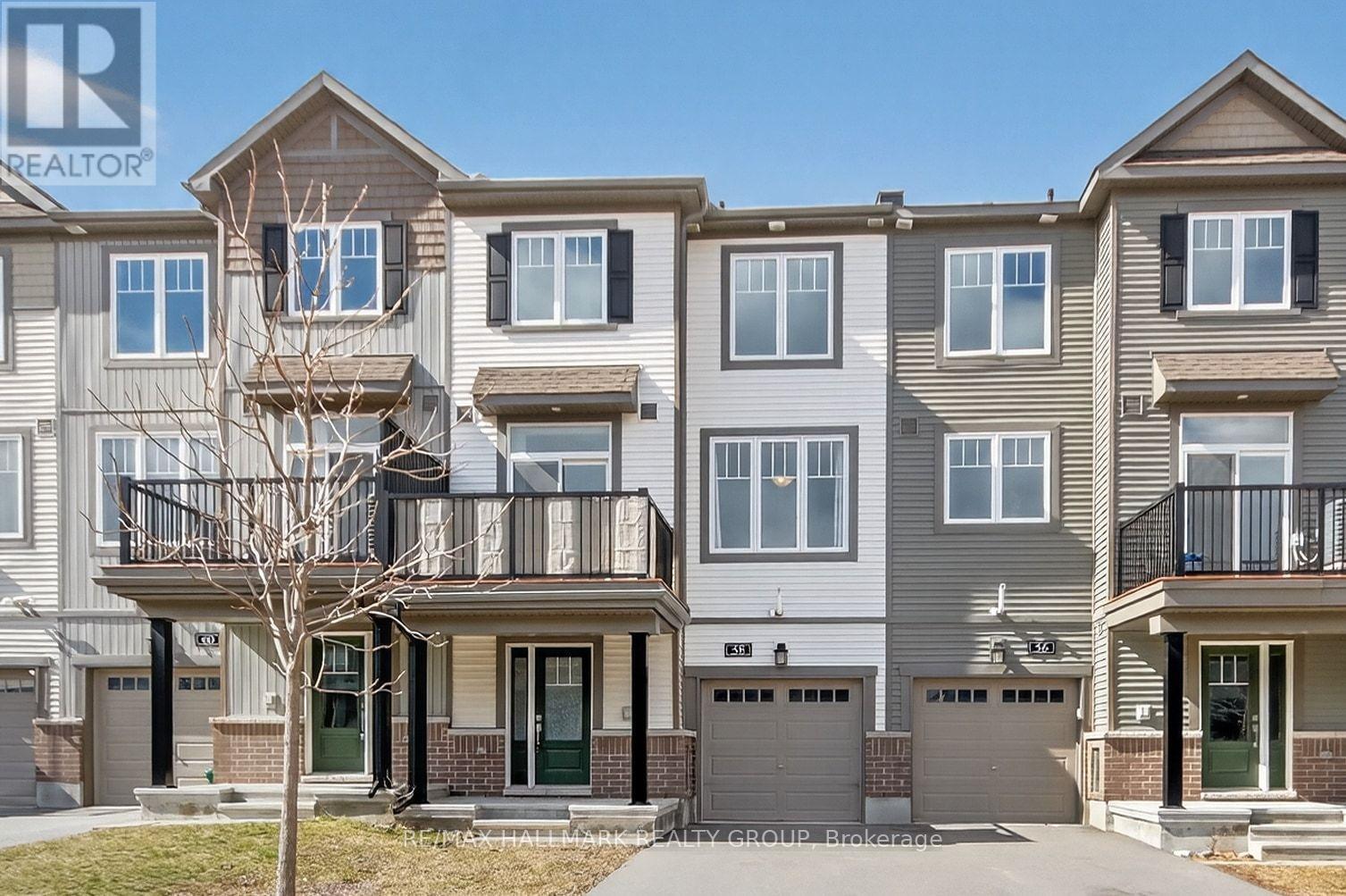 MODERN DESIGN MEETS CONVENIENCE. Experience this sun filled, bright 3-storey freehold townhome by Minto, located in the wonderful Half Moon Bay community of Barrhaven. Built in 2020, this stylish home features a meticulously maintained layout that balances open-concept living with space for entertaining family and friends.The main level is defined by a spacious living and dining area where expansive windows invite an abundance of natural light across the beautiful laminate flooring. Overlooking this space is a modern kitchen finished with ceramic tile, stainless steel appliances, and ample cabinetry. Directly off the dining area, a large private balcony provides a seamless transition to outdoor living and entertaining.The third floor offers a spacious primary suite featuring a large walk-in closet, alongside a generous second bedroom and a full 3-piece bathroom. Located just minutes from schools and parks, with quick access to transit and the best of Half Moon Bay. This home is move-in-ready, modern and stylish in a prime location. Don't miss your opportunity at home ownership! (id:48254)