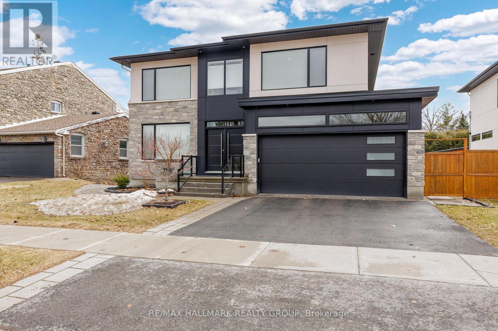 This stunning, custom built, 4-bed + den, 5-bath home offers approx. 4000 sq. ft. (Including 1000 sq.ft finished basement) of bright, thoughtfully designed living space with high-end finishes throughout. Nestled in the highly sought-after Mckellar Heights neighbourhood, known for its quiet, tree-lined streets and family-friendly charm. This meticulously maintained residence is perfect for modern family living. A welcoming foyer opens into a spacious living and dining area ideal for entertaining. The open-concept layout showcases a chef-inspired kitchen with a side-by-side fridge and freezer, 5-burner gas range, double sink, large island, and abundant storage. Bathed in natural light, this space connects seamlessly to a casual dining area and a generous family room featuring one of two gas fireplaces and direct access to the beautiful landscaped backyard. The main level also includes a well-designed mudroom with built-ins and a stylish powder room. The beautiful staircase leads to the second floor, where a bright and versatile den accompanies 4 well-appointed bedrooms all with ensuites (or "Jack & Jill") bathrooms. The primary suite boasts a spacious walk-in closet and 6-piece ensuite with heated floors, dual sinks, and a spacious shower area. The finished basement adds even more high-end living space, including a large recreation room, office/"man cave" with the second gas fireplace, and a 3-pc bathroom. Storage room and a cold room complete this level. Professionally installed media and sound system enhance the home's entertainment appeal. Ideally located near Carling Avenue and Hwy 417, this home offers easy access across the city. A 10-15 minute walk will get you to all needed amenities. Enjoy nearby green spaces like Kingsmere Park, convenient shopping at Carlingwood Mall & Fairlawn Plaza and access to well-regarded schools, the JCC and Ottawa's premier health club, Altea, making it an exceptional choice for families and professionals. (id:48254)