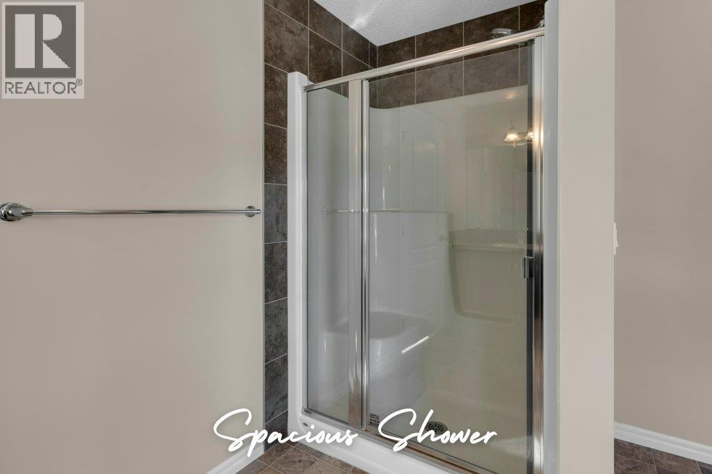 207 River Heights Crescent, Cochrane, Alberta  T4C 0V1 - Photo 24 - A2286899