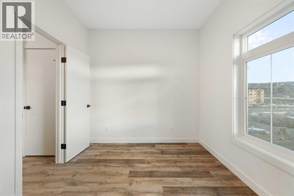 208, 156 Park Street, Cochrane, Alberta T4C 2B8 - Photo 31 - A2291443