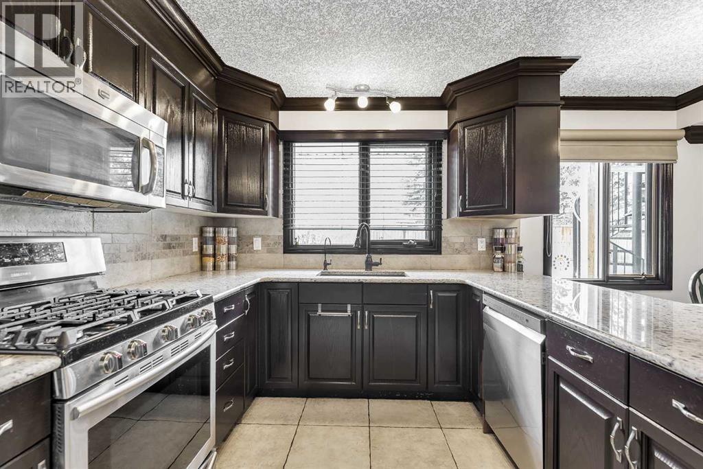 511 Woodpark Crescent SW, Calgary, Alberta  T2W 2S1 - Photo 14 - A2299796