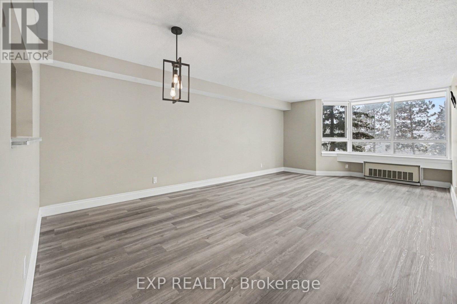 404 - 80 Sandcastle Drive, Ottawa, Ontario K2H 9E7 - Photo 3 - X12980120