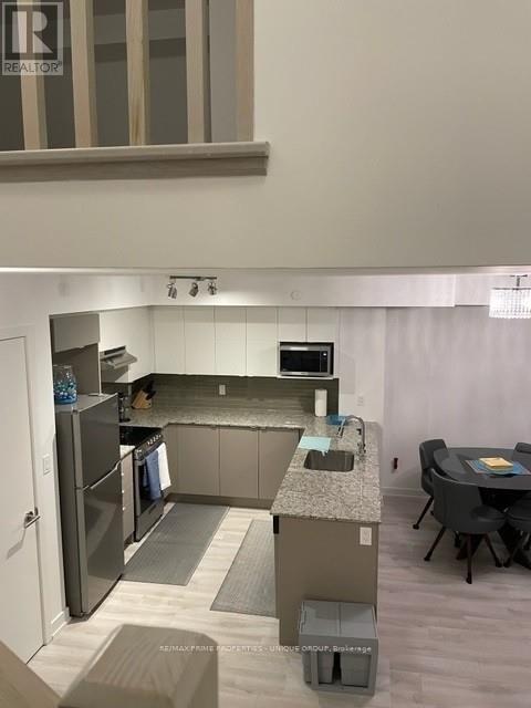 Th 109 - 106 Varna Drive, Toronto, Ontario  M6H 0C8 - Photo 13 - W12981096