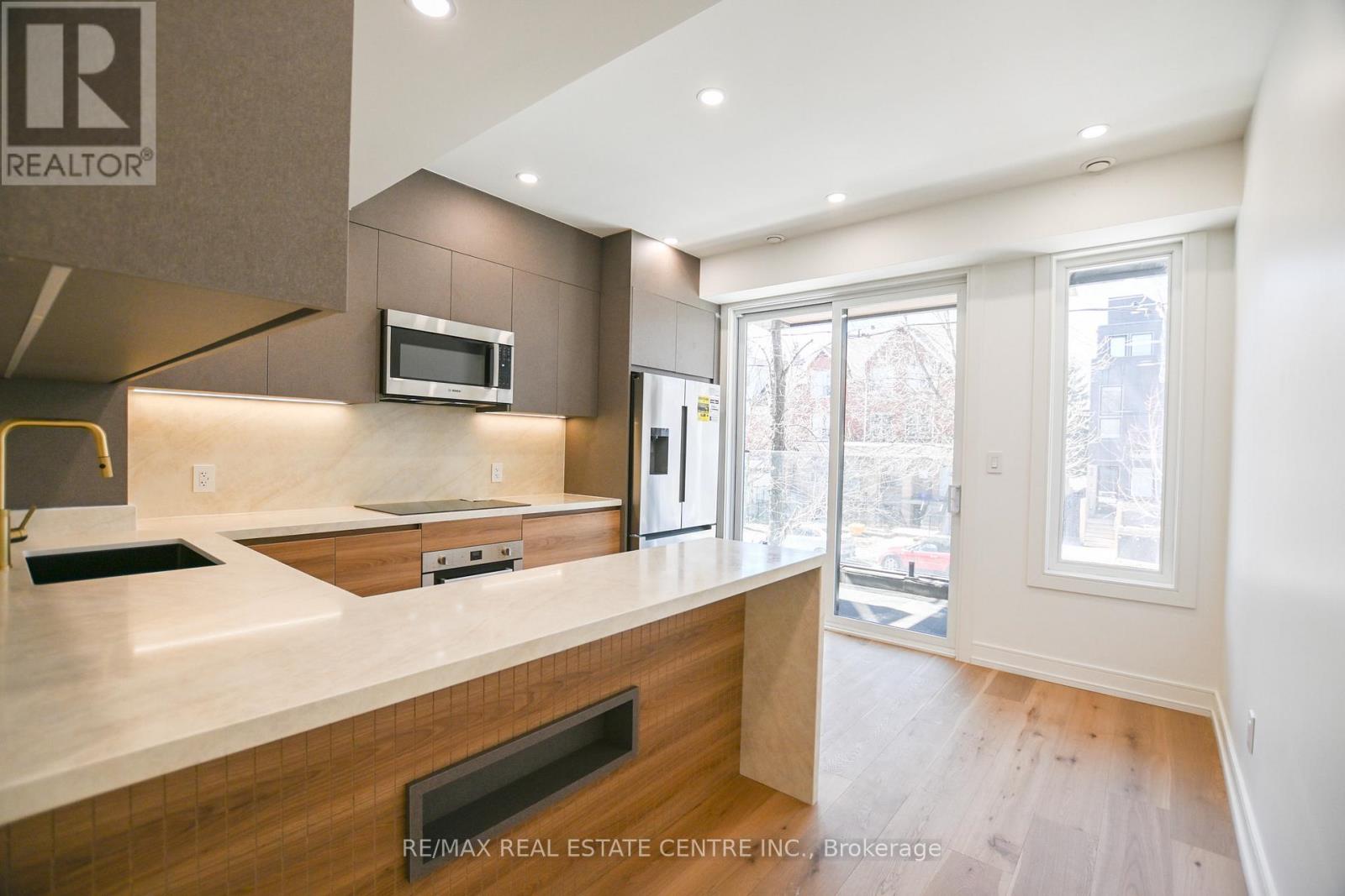 57 Jones Avenue, Toronto, Ontario  M4M 2Z7 - Photo 8 - E12986364