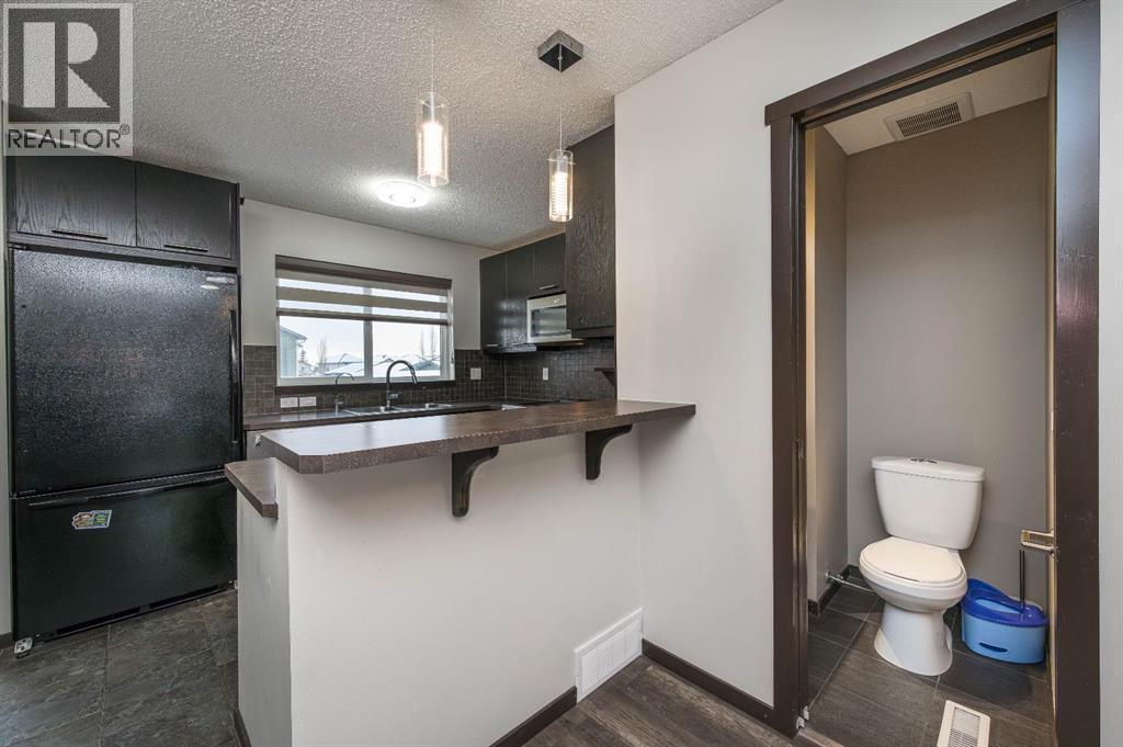 702 Panamount Boulevard NW, Calgary, Alberta  T3K 0P7 - Photo 13 - A2299325