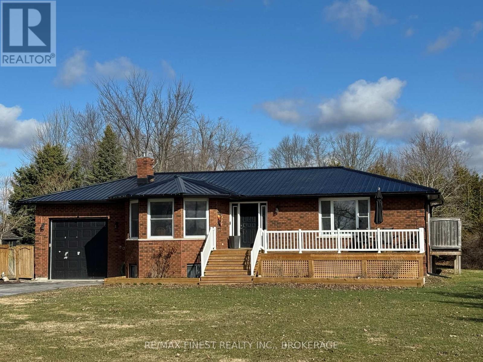 Welcome to 2055 Switzerville Road, a beautifully renovated all brick bungalow set on just over an acre of peaceful countryside, complete with an attached one car garage. Thoughtfully updated from top to bottom, this move-in-ready home blends modern finishes with timeless rural charm. Step inside to discover quality craftsmanship throughout, beginning with a bright eat-in kitchen featuring a striking waterfall island, generous cabinetry, and a seamless flow for everyday living and entertaining. A spacious separate dining room, framed by large windows, fills the space with natural light and scenic views. The main floor offers a private primary retreat with a three-piece ensuite and ample closet space, along with a second bedroom and a four-piece bath. Downstairs, the fully finished walk-up basement provides exceptional additional living space, including a cozy rec room warmed by a woodstove, two well-sized bedrooms, a three-piece bathroom, and a utility room with abundant storage and direct access to the garage. Outdoors, enjoy the tranquility of country living with a newly installed deck, gazebo, and an inviting in-ground saltwater pool that is perfect for long summer days and memorable gatherings. The expansive yard offers plenty of room to relax, entertain, or simply take in the surrounding natural beauty. Notable updates include a heat pump (2023), kitchen renovation (2023), woodstove (2024), metal roof (2024), pool liner (2022), pool pump (2024), and salt cell (2025) and so much more. This exceptional property offers the comfort of a modernized home paired with the serenity of an idyllic country setting. A true retreat close to town but far enough away to be immersed in the countryside. (id:48254)