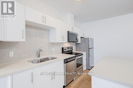 218 - 690 King Street, Kitchener, Ontario  N2H 5L8 - Photo 2 - X12990580