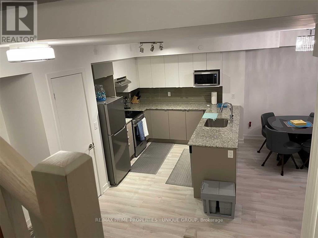 Th 109 - 106 Varna Drive, Toronto, Ontario  M6H 0C8 - Photo 4 - W12981096