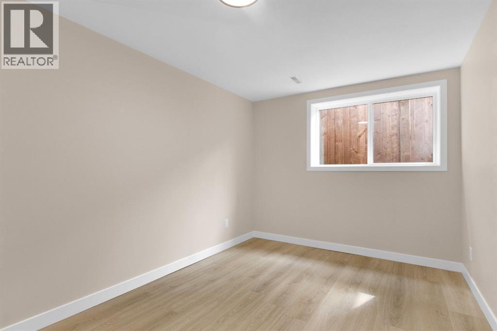 956 Bracewood Rise SW, Calgary, Alberta  T2W 3C9 - Photo 23 - A2299539