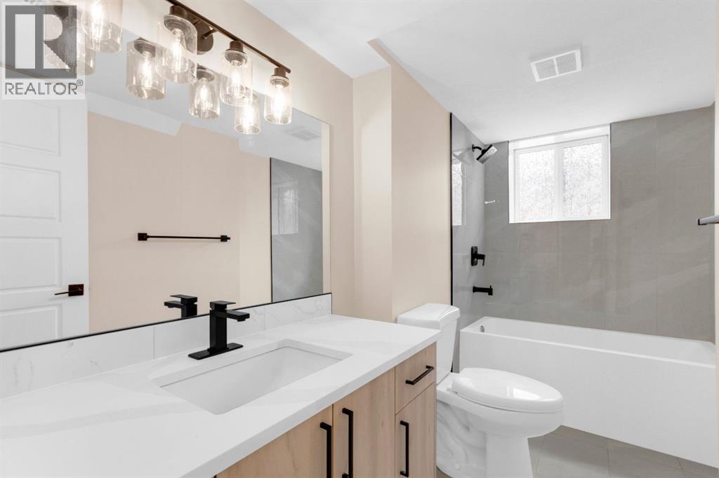 956 Bracewood Rise SW, Calgary, Alberta  T2W 3C9 - Photo 22 - A2299539