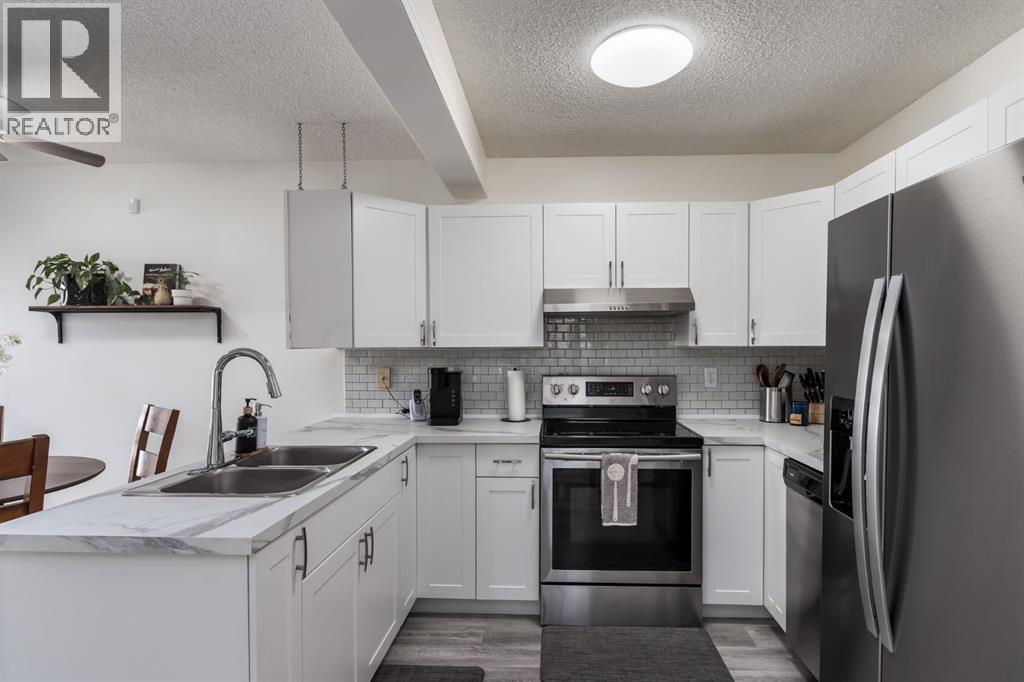 303 Coventry Close Ne, Calgary, Alberta  T3K 4C5 - Photo 6 - A2299541