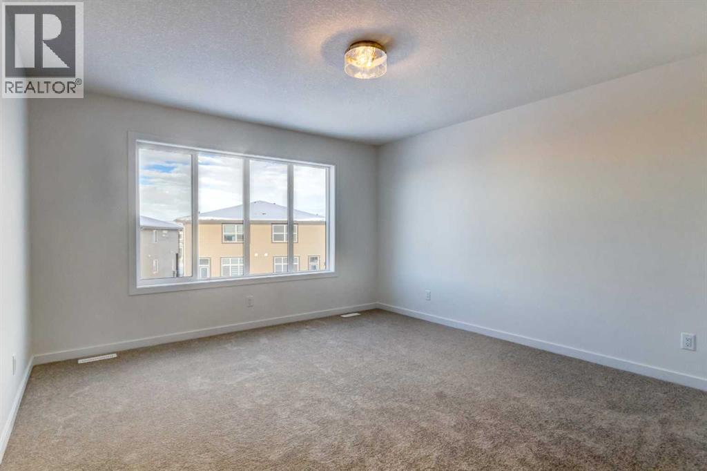 52 Magnolia Green Se, Calgary, Alberta T3M 3X8 - Photo 14 - A2273468