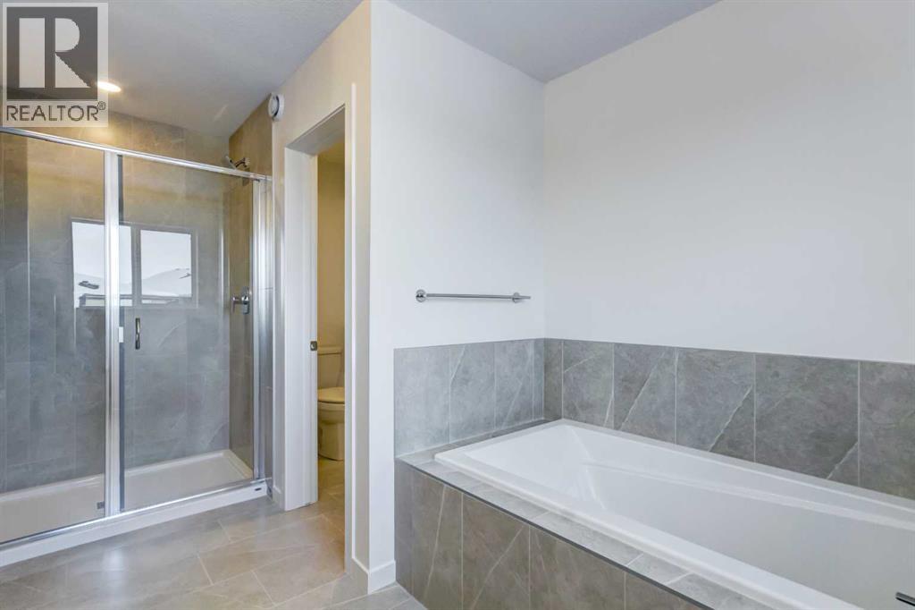 52 Magnolia Green Se, Calgary, Alberta T3M 3X8 - Photo 18 - A2273468