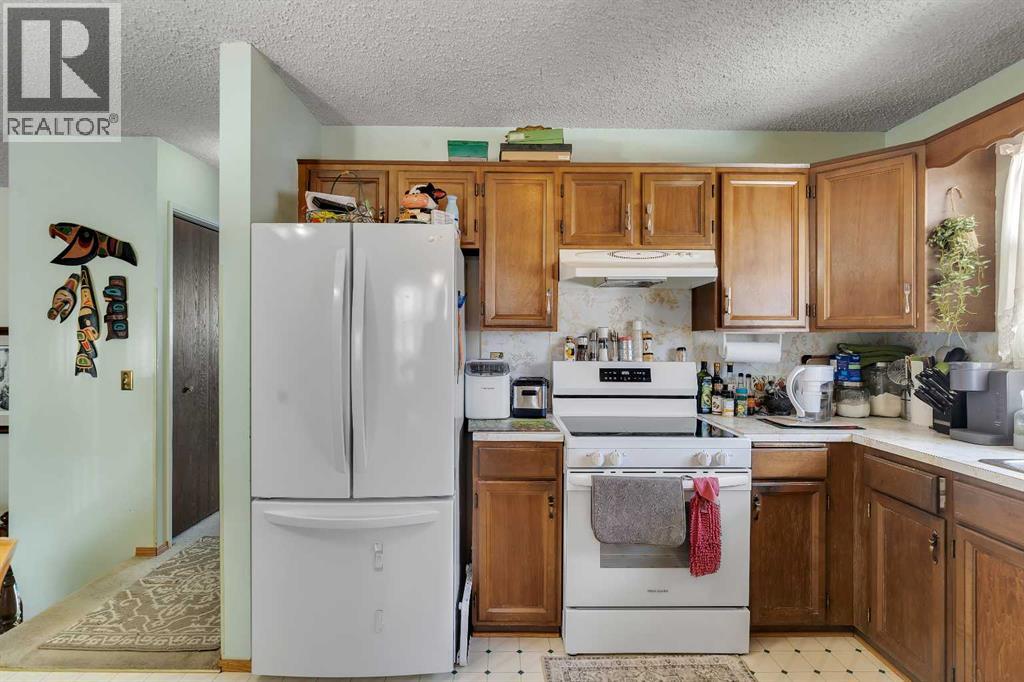 1003 Berkley Drive NW, Calgary, Alberta  T3K 1E3 - Photo 13 - A2301092