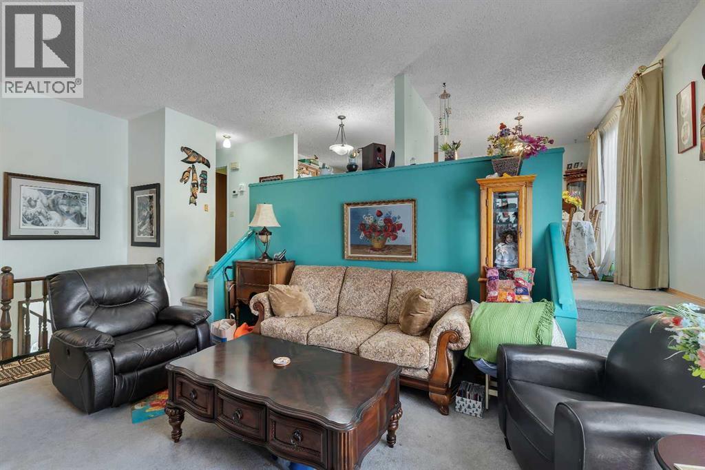 1003 Berkley Drive NW, Calgary, Alberta  T3K 1E3 - Photo 9 - A2301092