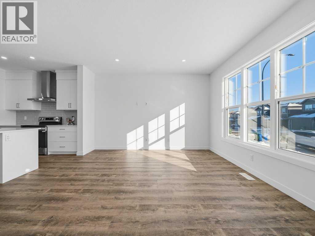 105 Creekstone Manor Sw, Calgary, Alberta  T2X 5W5 - Photo 4 - A2297741