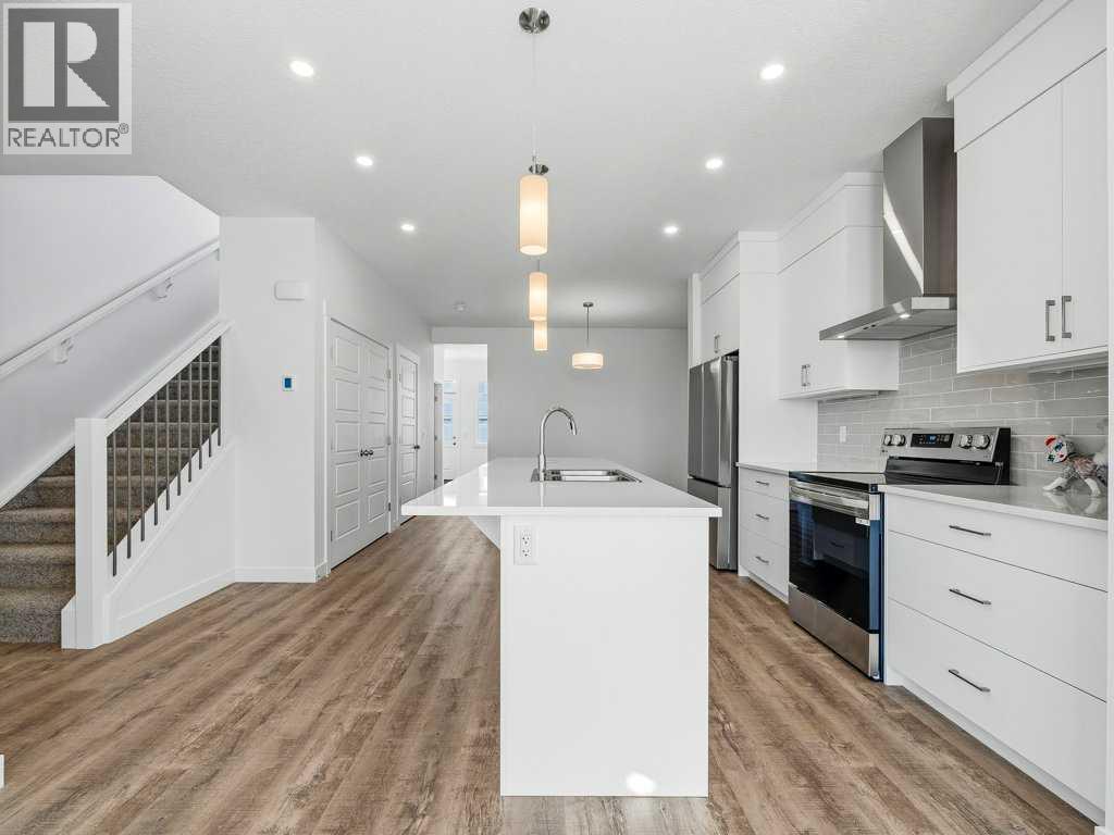 105 Creekstone Manor Sw, Calgary, Alberta  T2X 5W5 - Photo 6 - A2297741