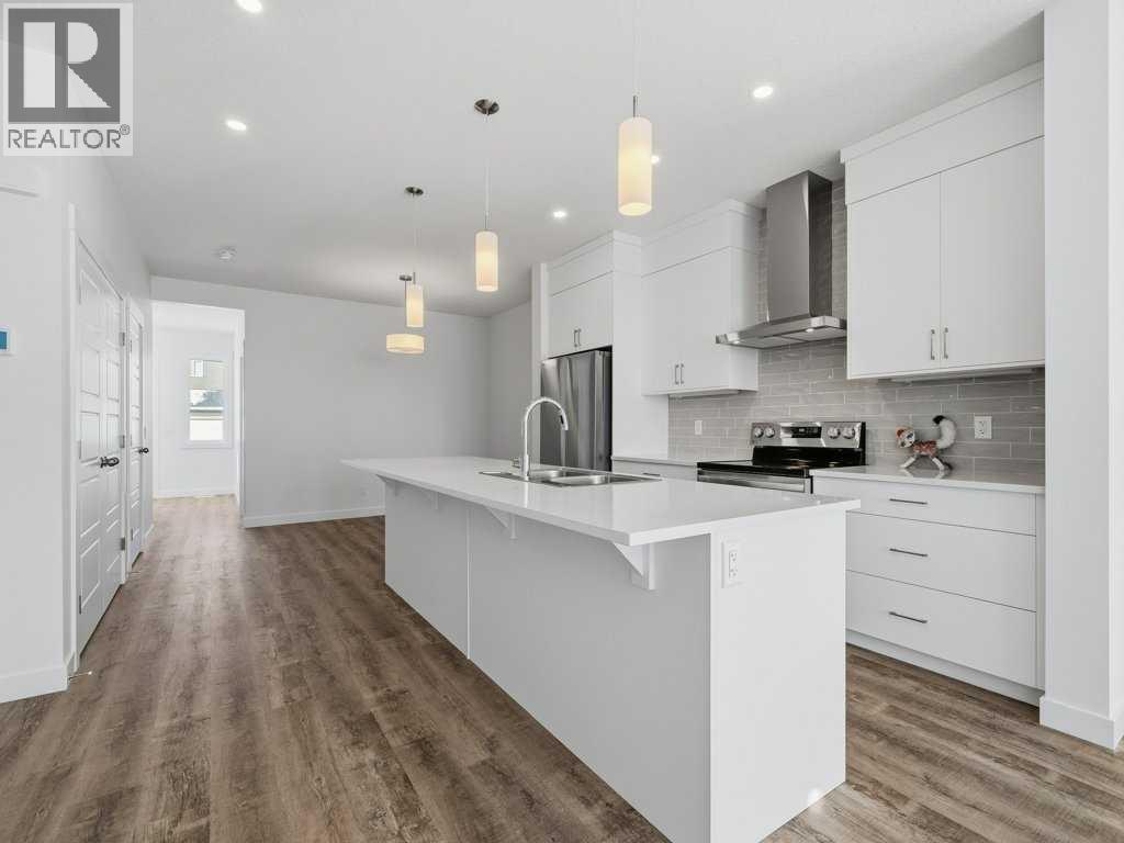 105 Creekstone Manor Sw, Calgary, Alberta  T2X 5W5 - Photo 7 - A2297741