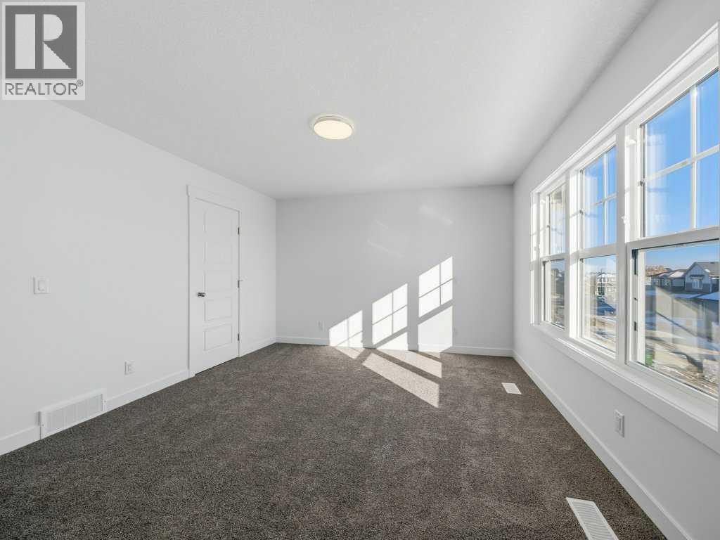 105 Creekstone Manor Sw, Calgary, Alberta  T2X 5W5 - Photo 21 - A2297741