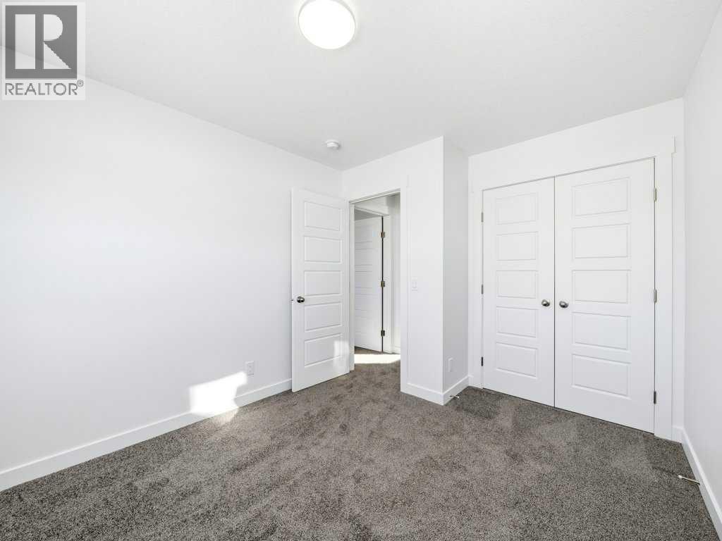 105 Creekstone Manor Sw, Calgary, Alberta  T2X 5W5 - Photo 27 - A2297741