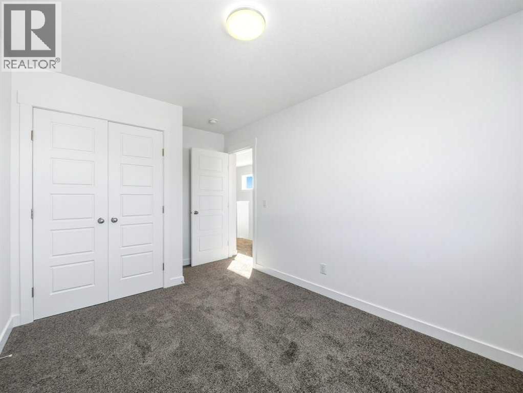 105 Creekstone Manor Sw, Calgary, Alberta  T2X 5W5 - Photo 25 - A2297741