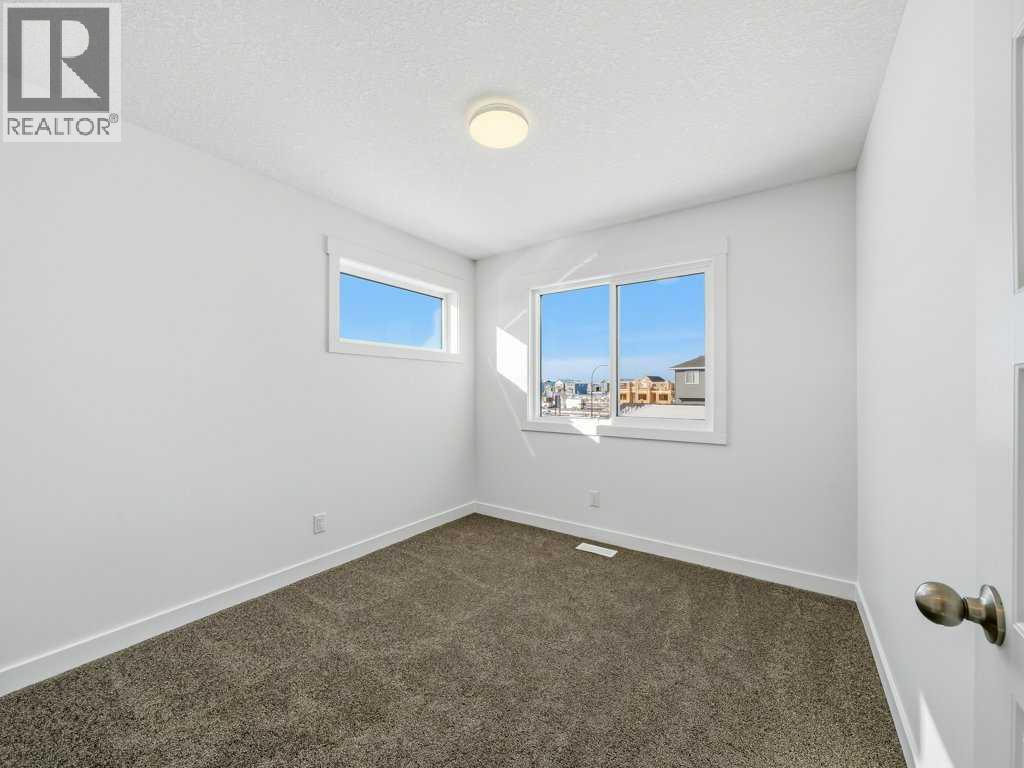 105 Creekstone Manor Sw, Calgary, Alberta  T2X 5W5 - Photo 26 - A2297741