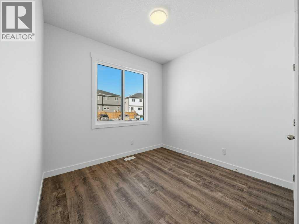 105 Creekstone Manor Sw, Calgary, Alberta  T2X 5W5 - Photo 12 - A2297741