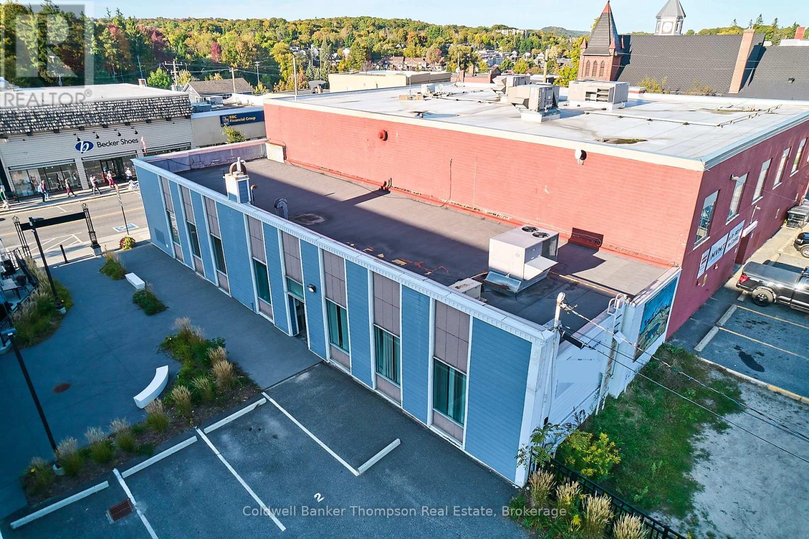 <div class="slider-price">$20 / ft<sup>2</sup></div><p>27 Main Street E, Huntsville, Ontario</p>