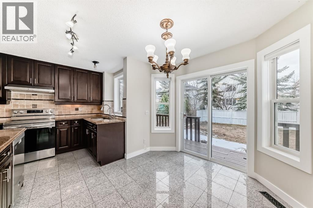 311 Rocky Ridge Cove NW, Calgary, Alberta T3G 4K1 - Photo 13 - A2300845