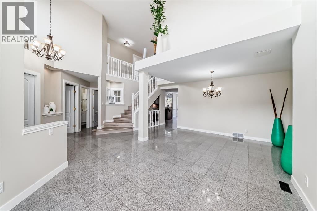 311 Rocky Ridge Cove NW, Calgary, Alberta T3G 4K1 - Photo 7 - A2300845