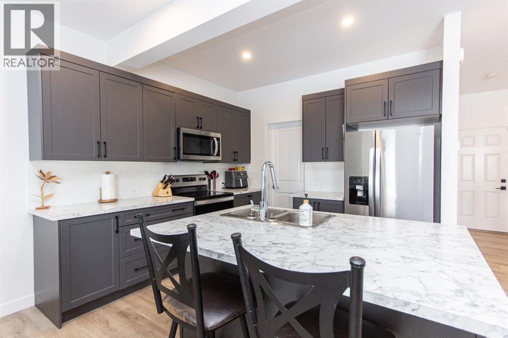 66 Henderson Crescent, Penhold, Alberta  T0M 1R0 - Photo 4 - A2290633