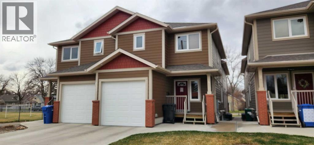 4, 637 12a Street N, Lethbridge, Alberta  T1H 2K1 - Photo 1 - A2302417