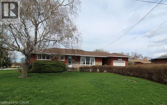 Pride of ownership!! This bungalow is walking distance to the park at the lake the local school, and right off the QEW!! This never before offered home, has updated vinyl windows, hardwood floors, garage, with extra storage in attic, green house with gas furnace, gorgeous new bathroom with walk in shower, rec room with gas fireplace & dry bar, newer roof, furnace/air 2016, updated 100 amp service with breaker's. (id:48254)