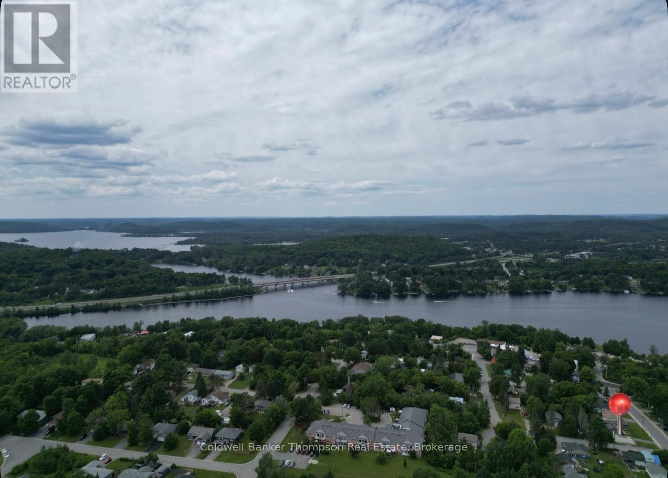 <div class="slider-price">$599,000</div><p>13 Yonge Street S, Huntsville, Ontario</p>