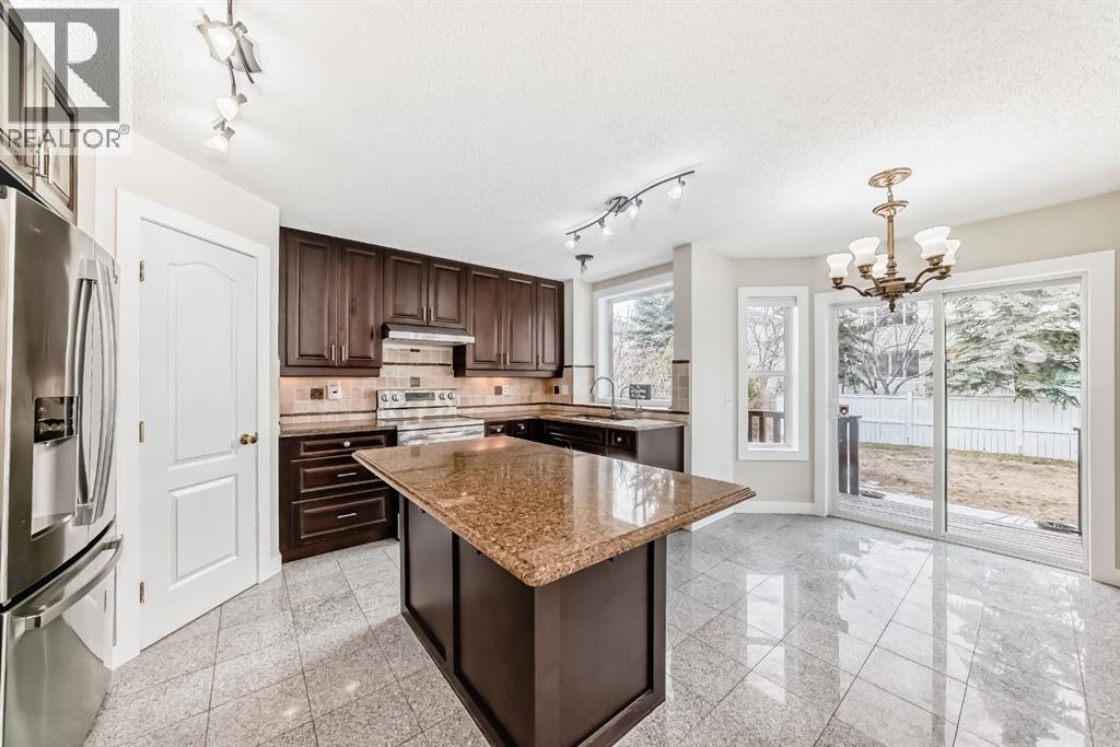 311 Rocky Ridge Cove Nw, Calgary, Alberta  T3G 4K1 - Photo 11 - A2300845