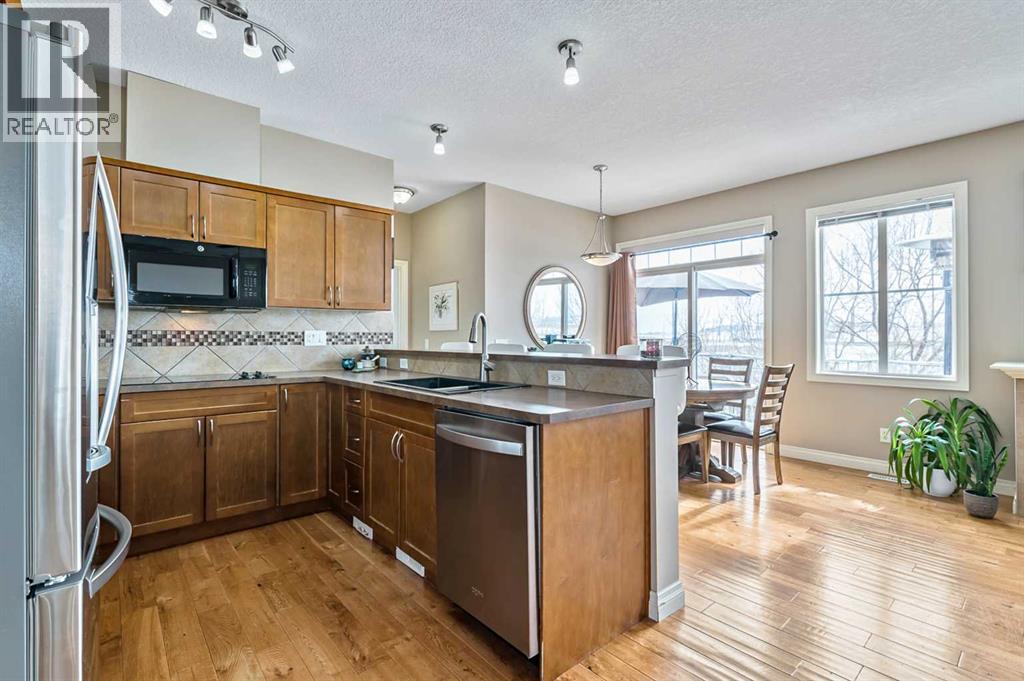 79 Tucker Circle, Okotoks, Alberta  T1S 2J7 - Photo 4 - A2298937