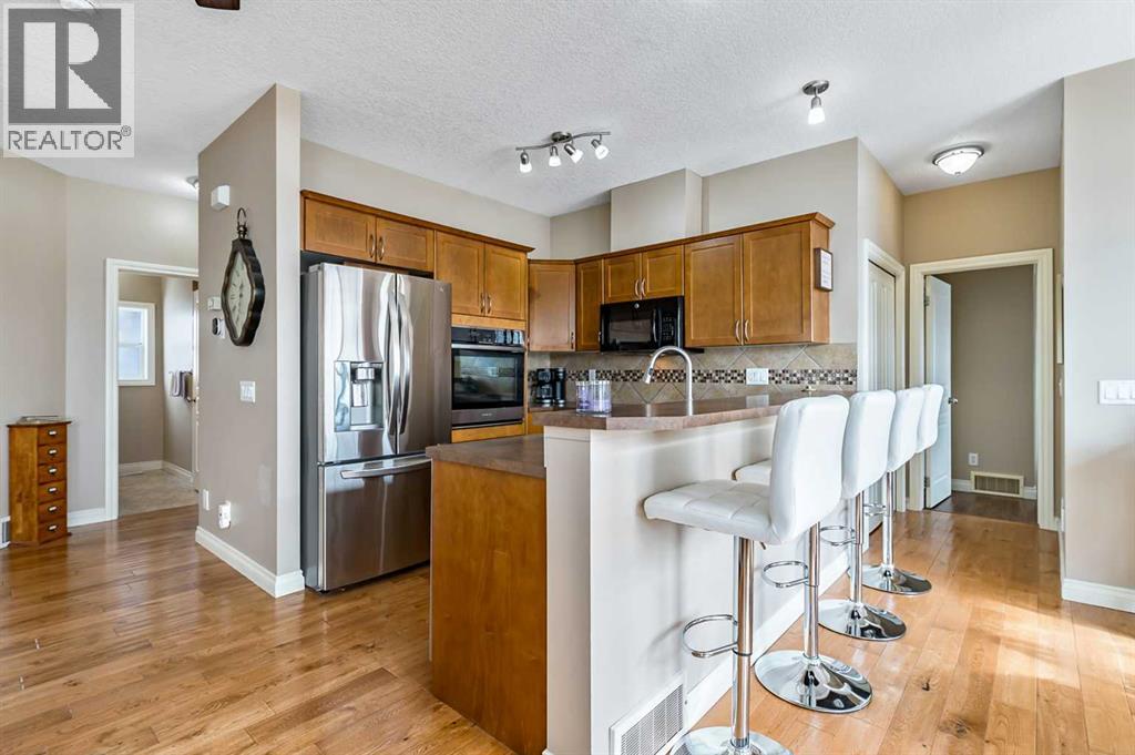 79 Tucker Circle, Okotoks, Alberta  T1S 2J7 - Photo 7 - A2298937