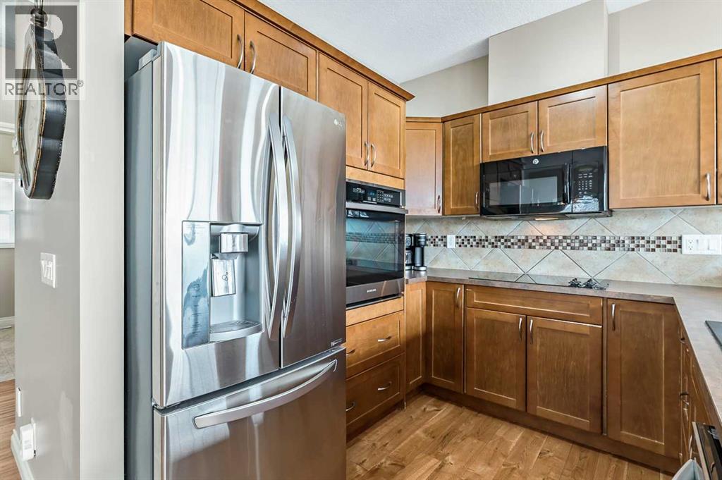 79 Tucker Circle, Okotoks, Alberta  T1S 2J7 - Photo 6 - A2298937