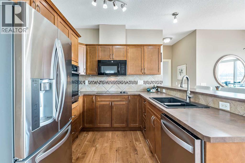 79 Tucker Circle, Okotoks, Alberta  T1S 2J7 - Photo 5 - A2298937