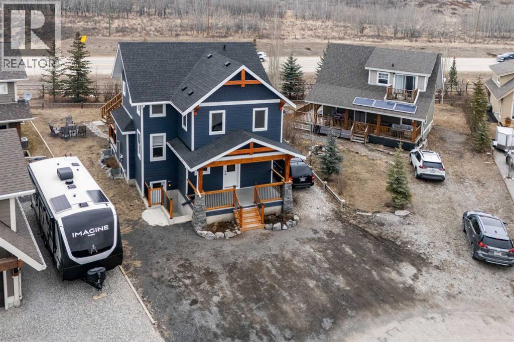 216 Cottageclub Crescent, Rural Rocky View County, Alberta  T4C 1B1 - Photo 3 - A2302814