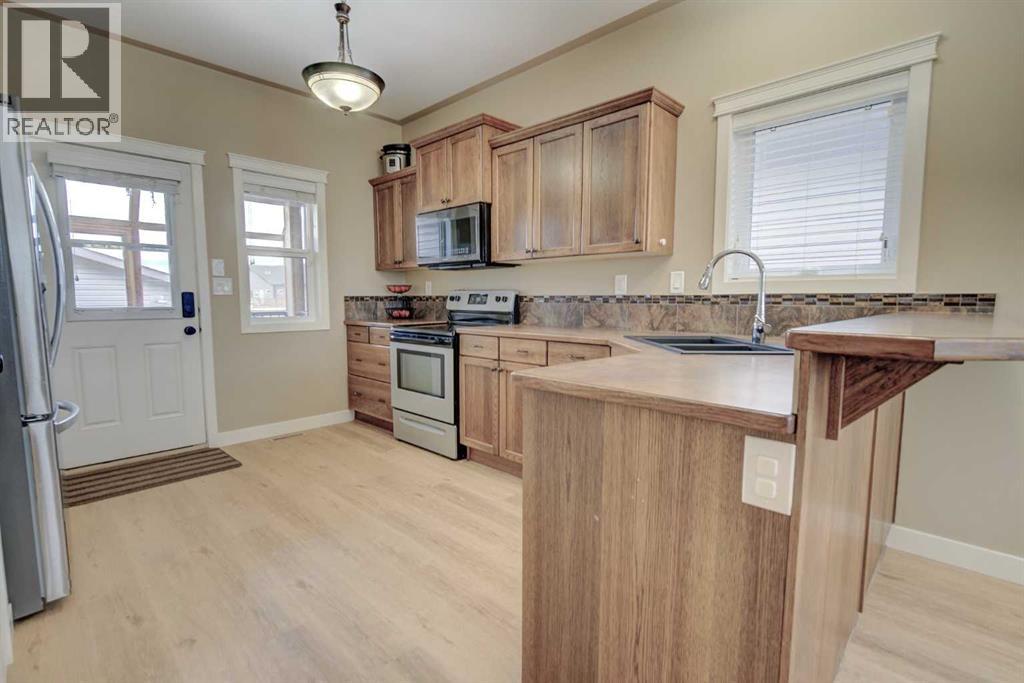 82 Harvest Close, Penhold, Alberta  T0M 1R0 - Photo 4 - A2302008