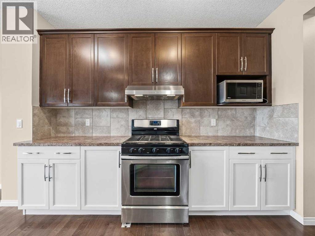 32 Panatella Parade NW, Calgary, Alberta  T3K 0T8 - Photo 5 - A2302640