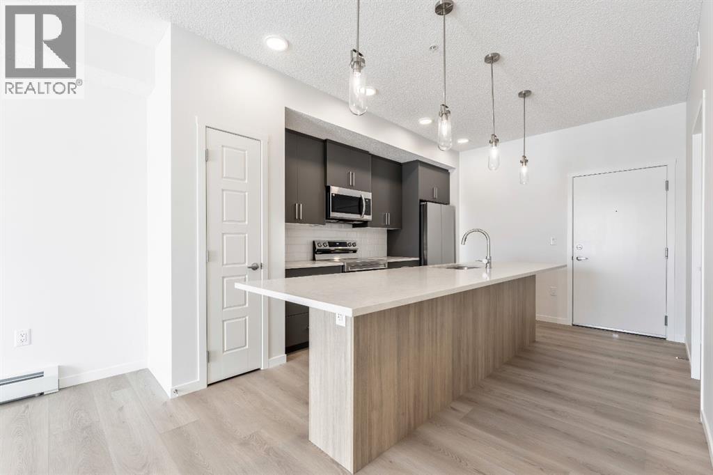 419, 245 Edith Place Nw, Calgary, Alberta  T3R 2M7 - Photo 2 - A2299502