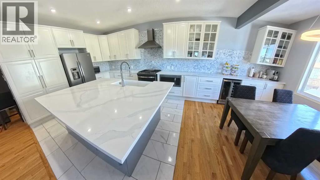 466 Cimarron Boulevard, Okotoks, Alberta  T1S 0H7 - Photo 5 - A2292029