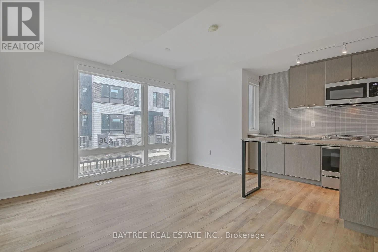 Th4 - 30 Ed Clark Gardens, Toronto, Ontario  M6N 0B5 - Photo 4 - W13015848