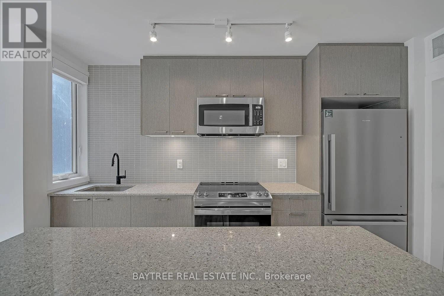 Th4 - 30 Ed Clark Gardens, Toronto, Ontario  M6N 0B5 - Photo 5 - W13015848