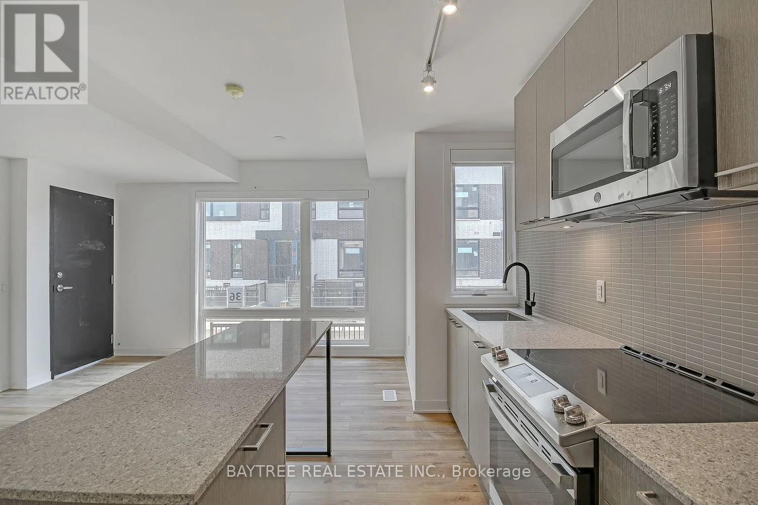 Th4 - 30 Ed Clark Gardens, Toronto, Ontario  M6N 0B5 - Photo 8 - W13015848