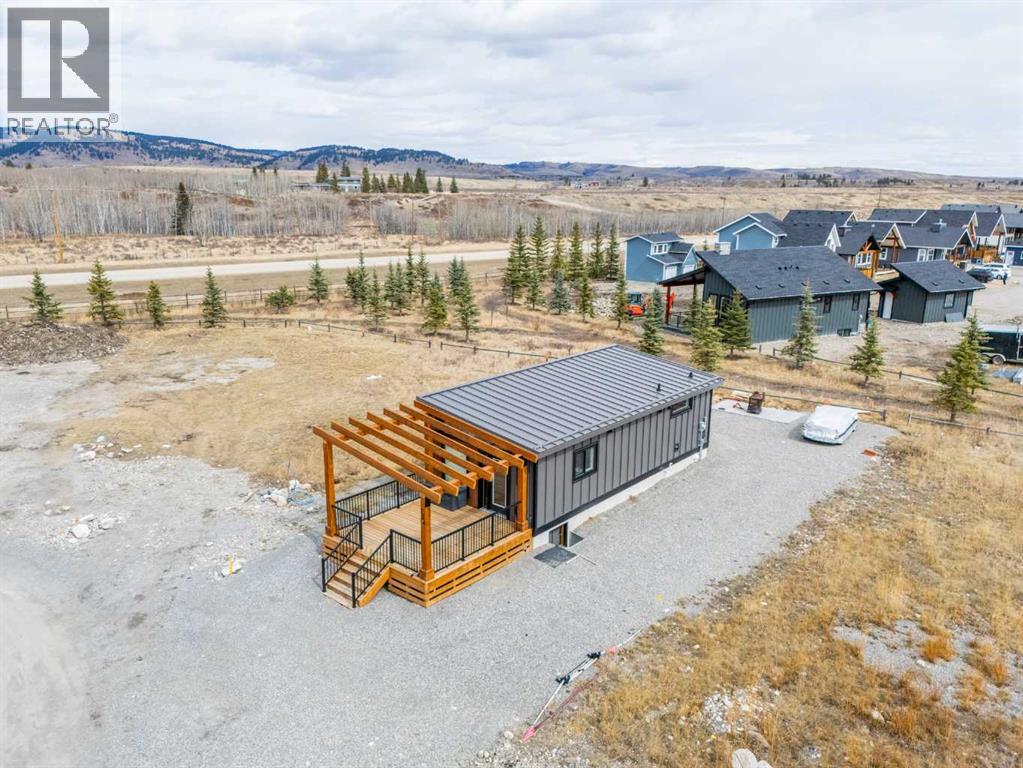 134 Cottageclub Court, Rural Rocky View County, Alberta  T4C 1B1 - Photo 5 - A2302815