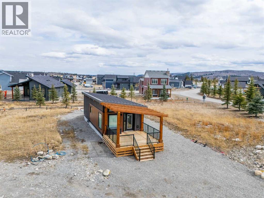 134 Cottageclub Court, Rural Rocky View County, Alberta  T4C 1B1 - Photo 4 - A2302815