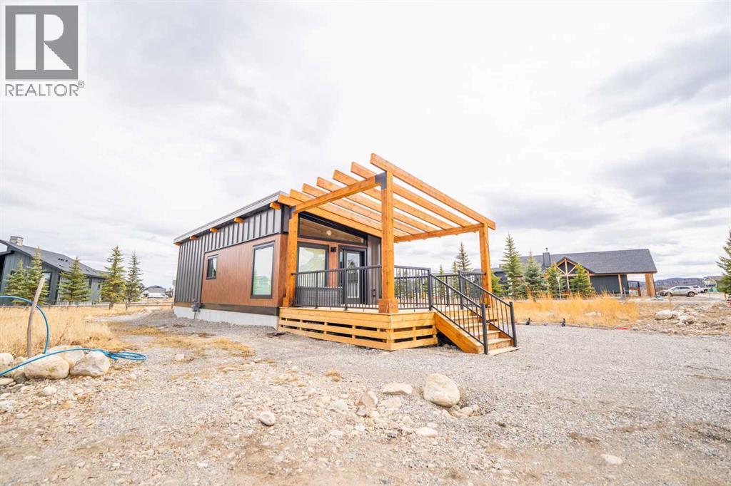 134 Cottageclub Court, Rural Rocky View County, Alberta  T4C 1B1 - Photo 7 - A2302815